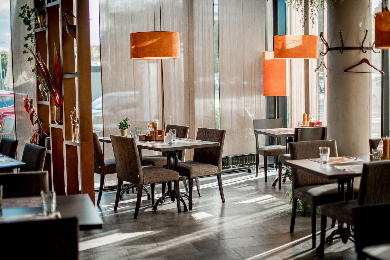 Cozy restaurant interior featuring elegant decor and warm lighting.